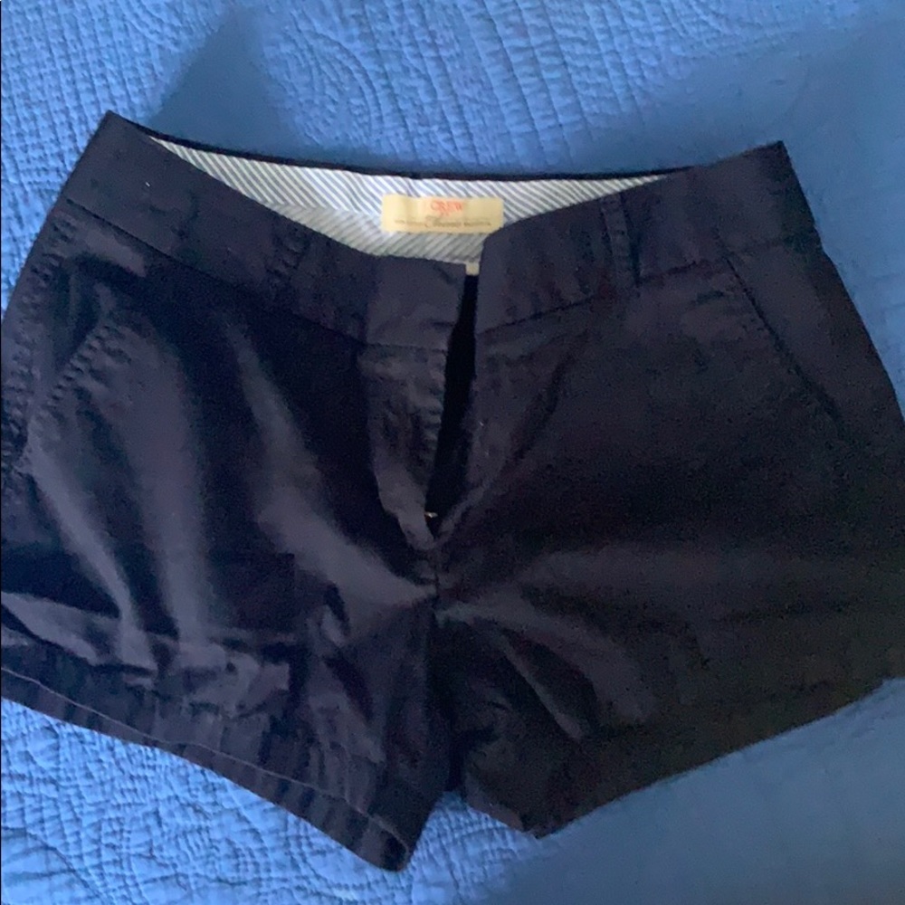 Never worn- navy shorts!